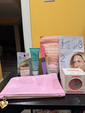 Pouch, shower steamers, nail file, face mask, shampoo, lip scrub, bath bomb